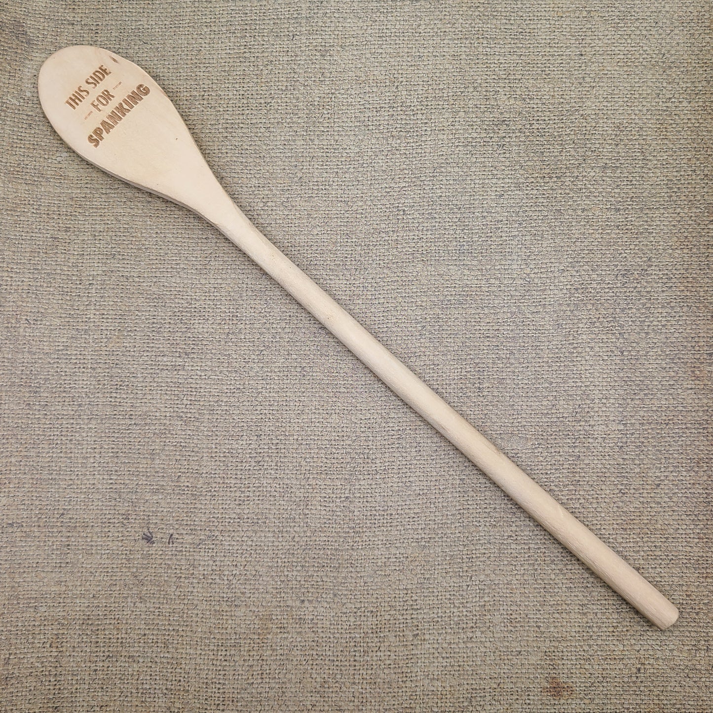 "This side for stirring/This side for spanking" wooden spoon