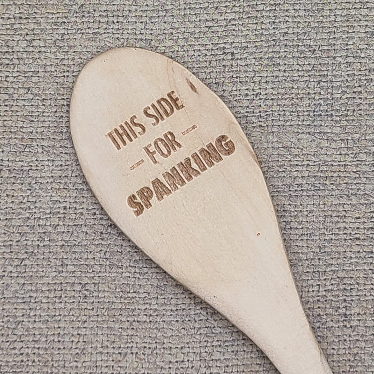 "This side for stirring/This side for spanking" wooden spoon