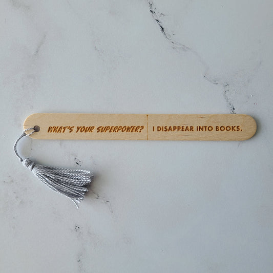 "What's your superpower? I disappear into books." popsicle bookmark