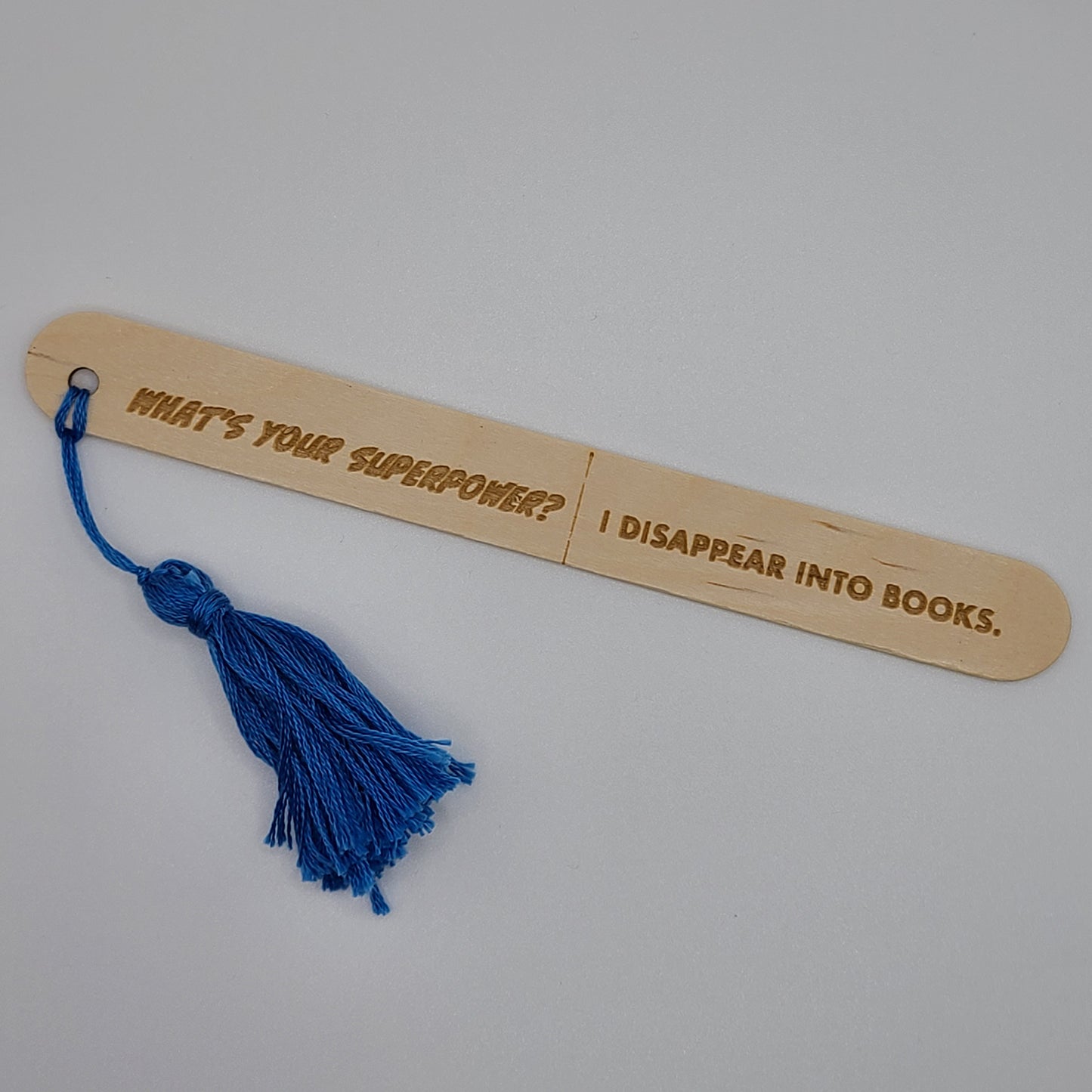 "What's your superpower? I disappear into books." popsicle bookmark